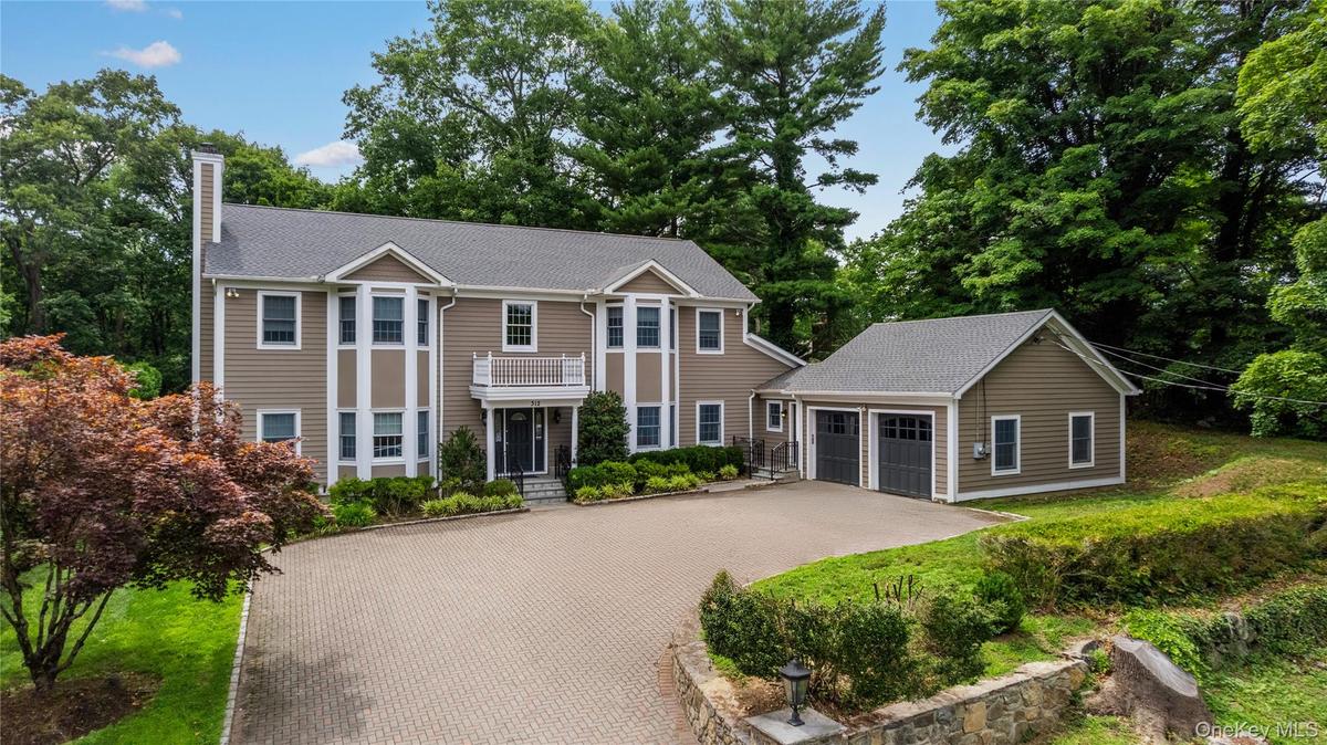 Showing 2 Car Attached Garage and spacious driveway for additional Parking