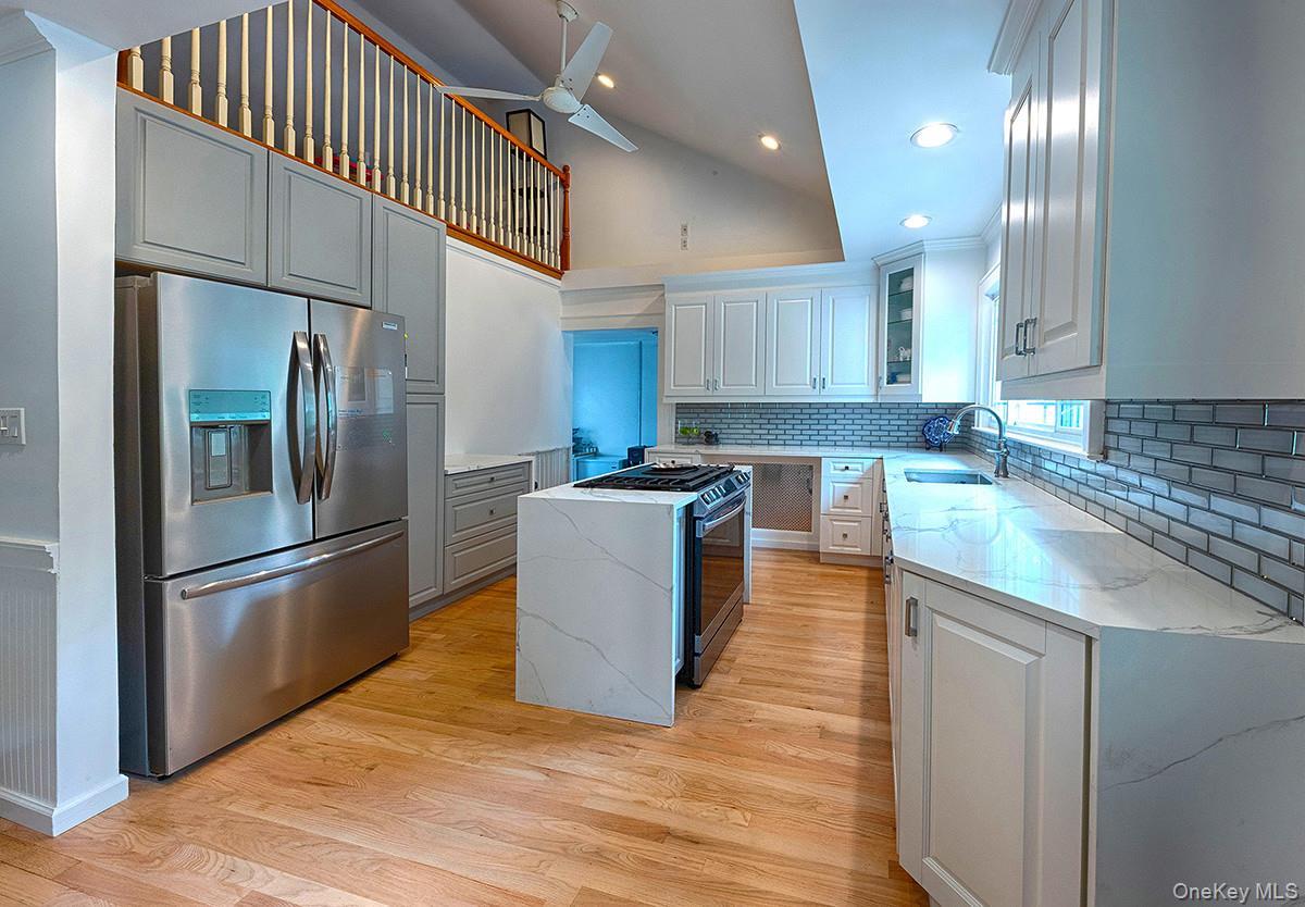 Totally gutted and renovated with all new appliances, wood panel floors, window etal