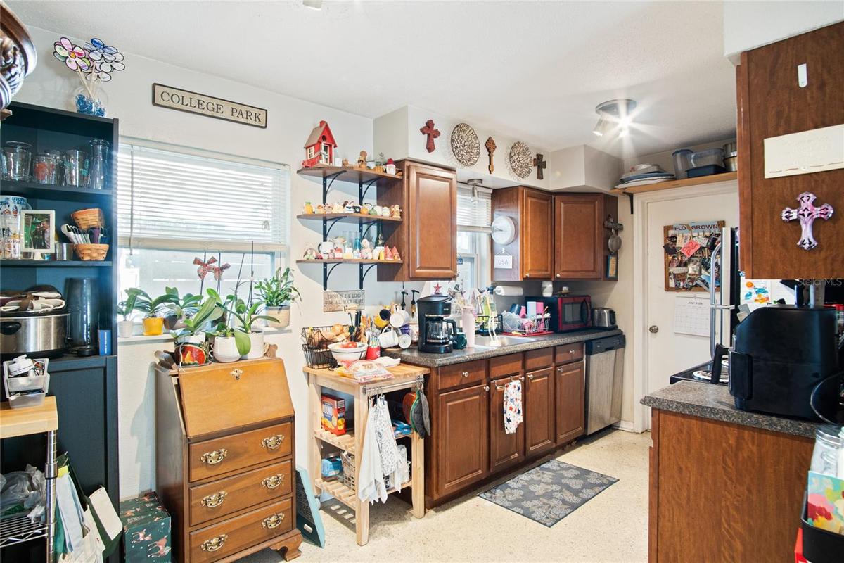The kitchen provides a range, refrigerator, and dishwasher.