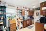 The kitchen provides a range, refrigerator, and dishwasher.