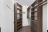 Cabinetry and organization in primary bedroom