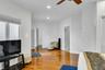 Living room with light wood-style floors, recessed lighting, and a ceiling fan