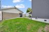SIDE YARD [N/E] FACING GARAGE