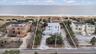 Drone / aerial view with a water view and a view of the beach