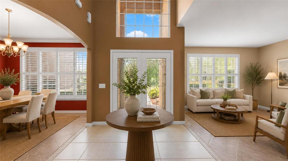 Grand entry & souring ceilings greet your guests. (virtually staged)