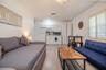 Shared living room with 2 sofa beds, dining table, kitchenette