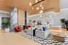 Elegant double-height lobby with curated furnishings and concierge reception