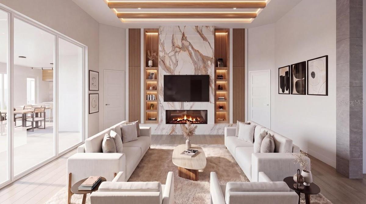 Great room with modern inset fireplace, stunning feature wall and high ceilings with beautiful wood beam details