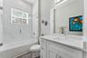 Full Bathroom Upstairs with a soaking tub, frameless glass doors and rainfall showerhead