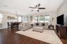 Light filled living room with wood-look tile flooring
