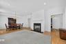 The gas fireplace anchors the open living and dining space, adding warmth and charm to the main level.