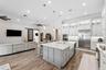 The kitchen island also offers ample space from meal prepping.