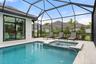 The spa flows seamlessly into the pool.