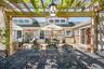 View of patio / terrace featuring a pergola and outdoor dining space