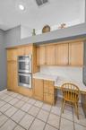 Kitchen w/double Jenn-Aire ovens and desk space