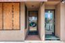 View of exterior entry with stucco siding