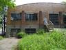 Back of building featuring brick siding