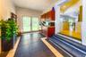 Entry foyer from front  side of house, laundry and modern kitchenette