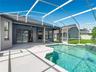 Enjoy your private screened-in pool, perfect for Florida living year-round