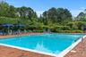 Community pool with a patio area
