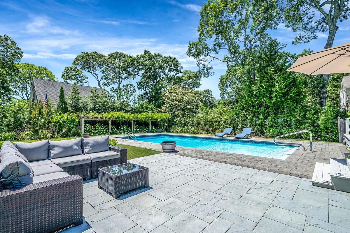 Swimming pool featuring a patio area and an outdoor hangout area