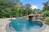 Outdoor pool featuring a patio