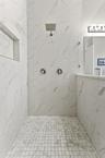 Large Primary Ensuite Walk-In Shower with frameless glass door and rainfall showerhead