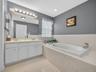 Soaking tub, double vanity.
