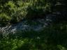 Part of the acre of property is a lovely natural stream. Walk a little closer to hear the tranquil sounds and get lost in nature.