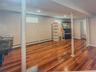 Below grade area featuring wood finished floors and baseboards
