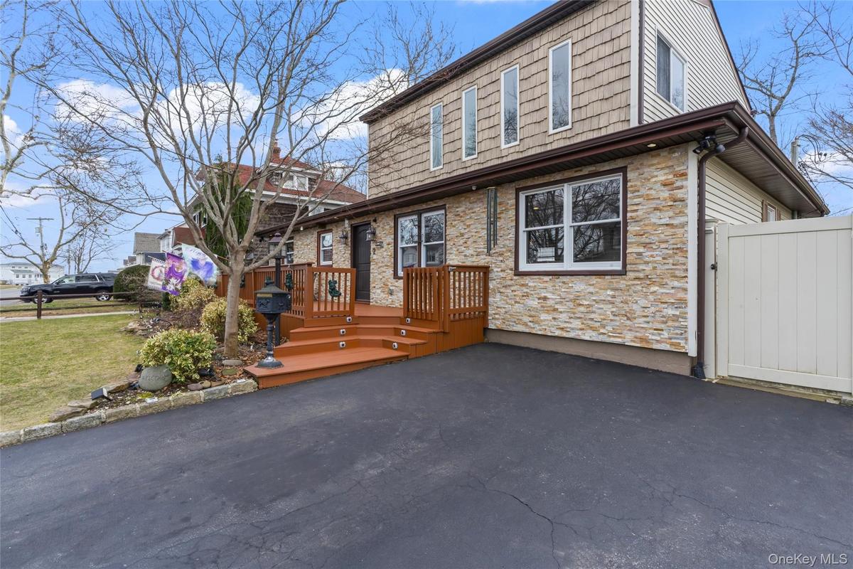 Elevated Entry with a wooden deck.