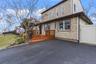 Elevated Entry with a wooden deck.