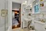 Newly renovated en-suite  bathroom,  shower / bath combination with glass door, and subway tile walls, basketweave tile floors
