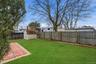 Fenced backyard with a shed