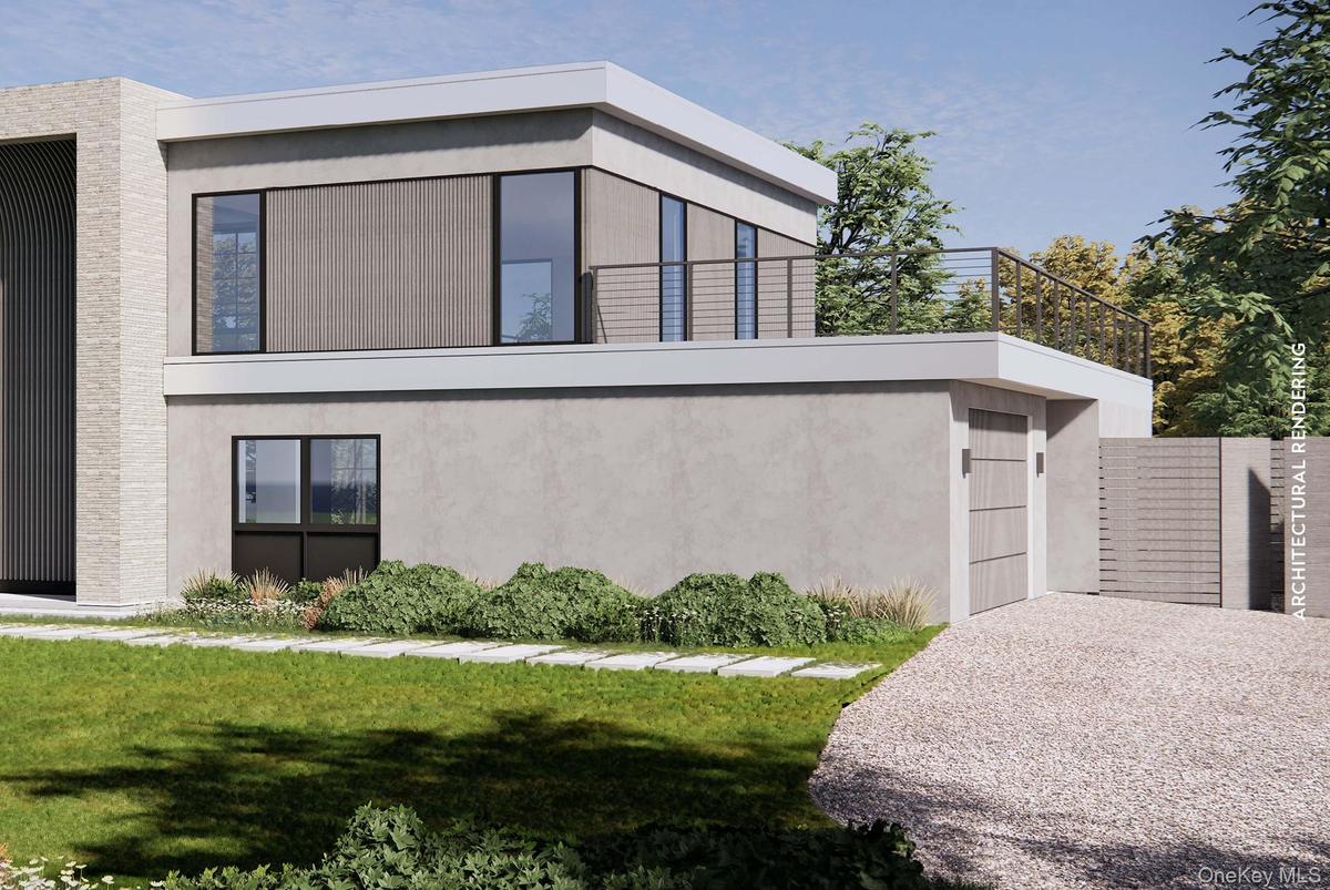View of side of property with stucco siding and a lawn