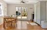 Dining area with crown molding, plenty of natural light, light wood finished floors, and a ceiling fan