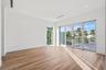 Natural light cascades throughout this exceptional corner unit primary bedroom.