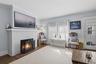 Living Room With Hard Wood Flooring and Fireplace (#220)