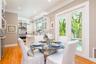 Breakfast room, built in wine rack, microwave, wine cooler and beverage refrigerator, open to kitchen