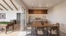 Cross section of recreation room and outdoor kitchen fitted with high end grill, ice-maker and refrigerator