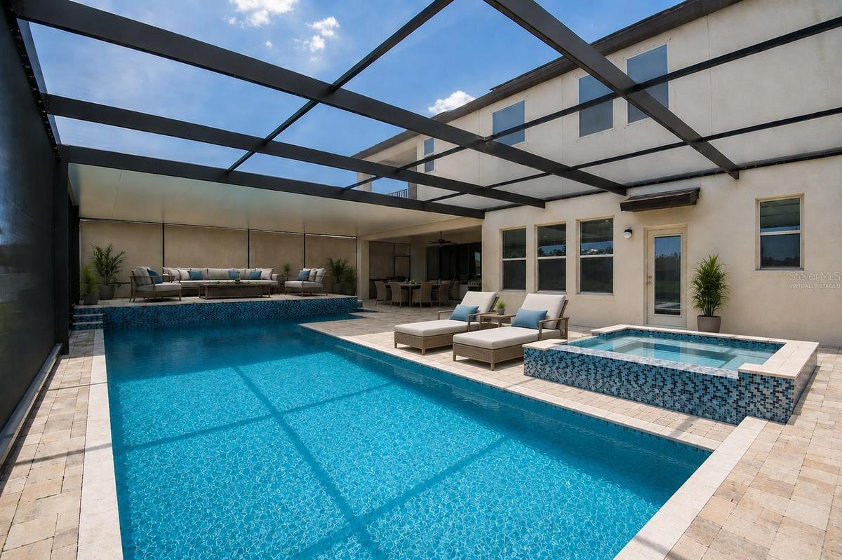 Pool lanai virtually staged with furniture.