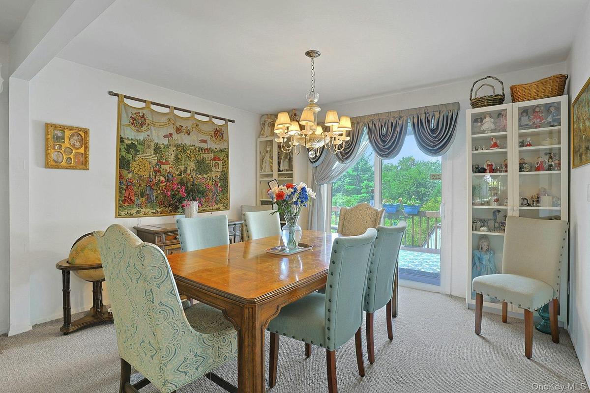 Here is the beautiful Dining area with sliding glass doors out to a very generous size deck.