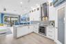 Kitchen Featuring Wolf Induction Cooktop, Wolf Built-in Oven, Subzero Refrigerator, and Bosch Paneled Dishwasher