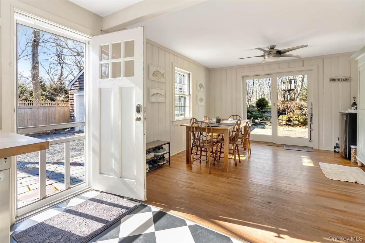 Dining room featuring a ceiling fan and wood finished floors