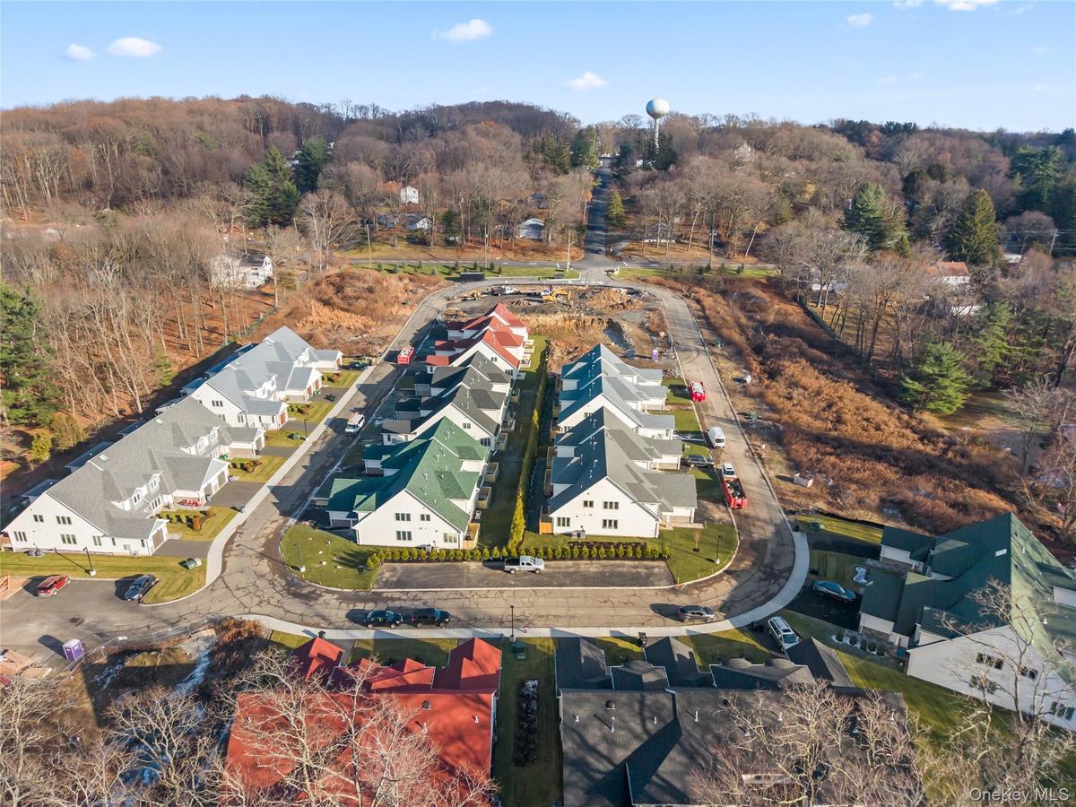 Aerial perspective of suburban area with a heavily wooded area