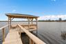 Recently renovated dock offering boating,fishing, sunset views and peaceful lakefront living.