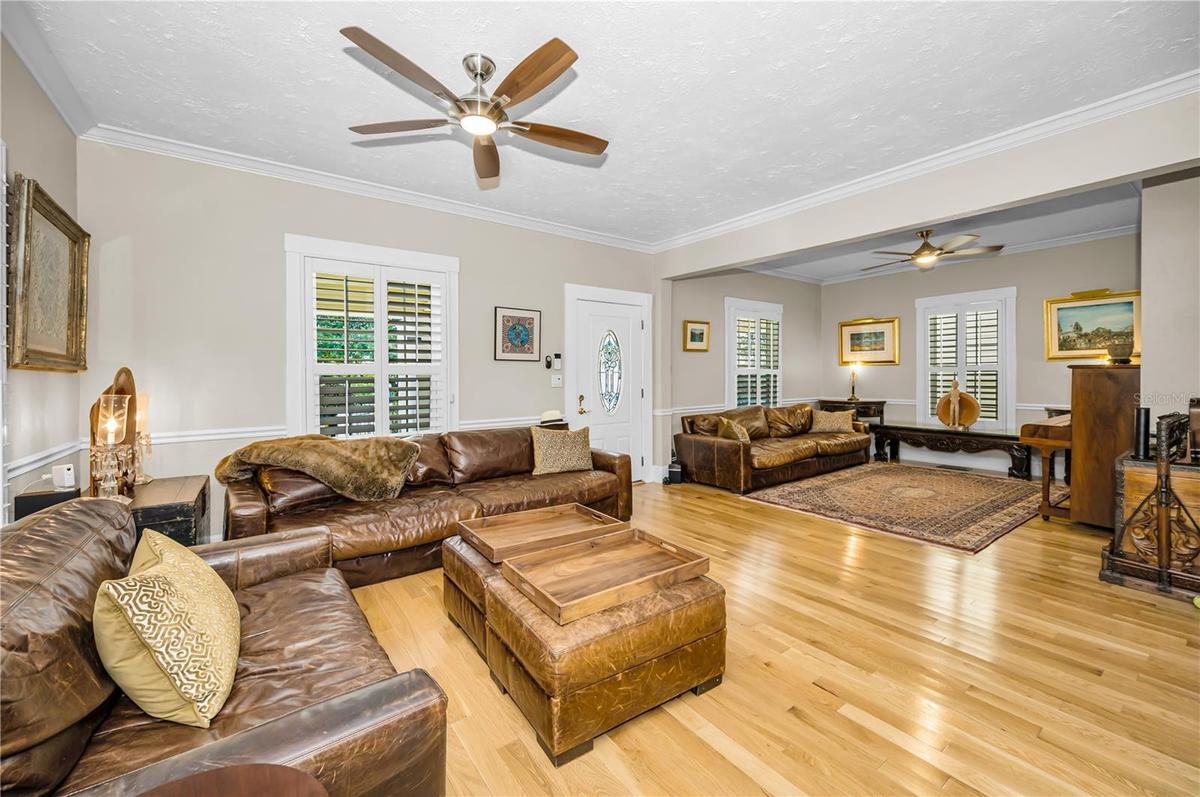 A formal living room with a dedicated music area.