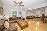 A formal living room with a dedicated music area.