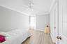 3rd bedroom with vaulted ceiling and large walk in closet