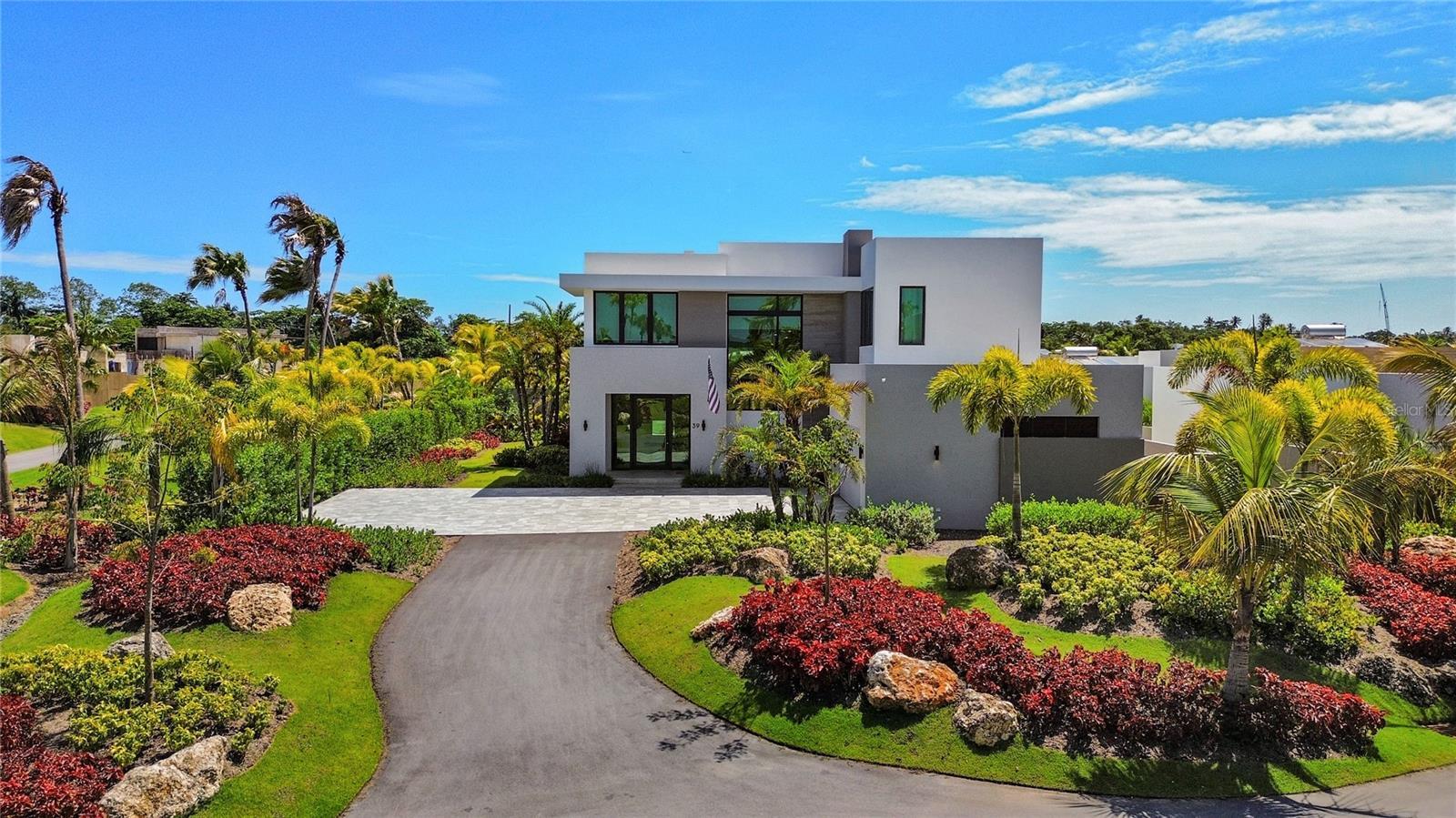 Nestled on a quiet cul-de-sac and offered fully furnished, this exceptional two-story residence combines elegant design, resort-style amenities, and c